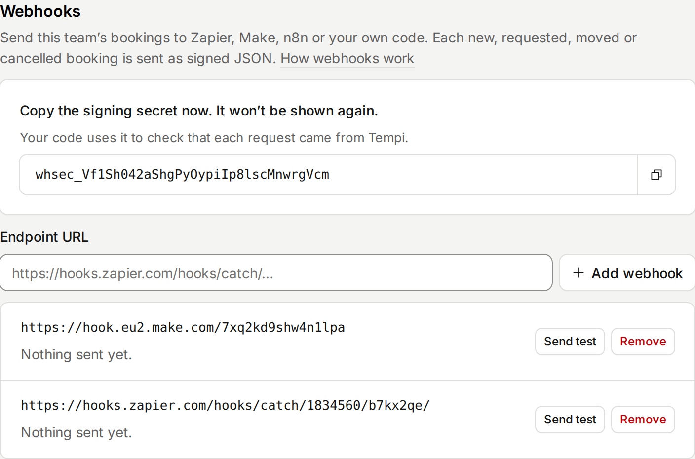 The Webhooks section of a team page: the signing secret to copy, the field to add an endpoint URL, and two webhooks, one to Make and one to Zapier, each with Send test and Remove.